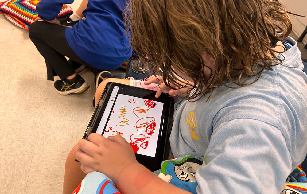 Arkie using a tablet