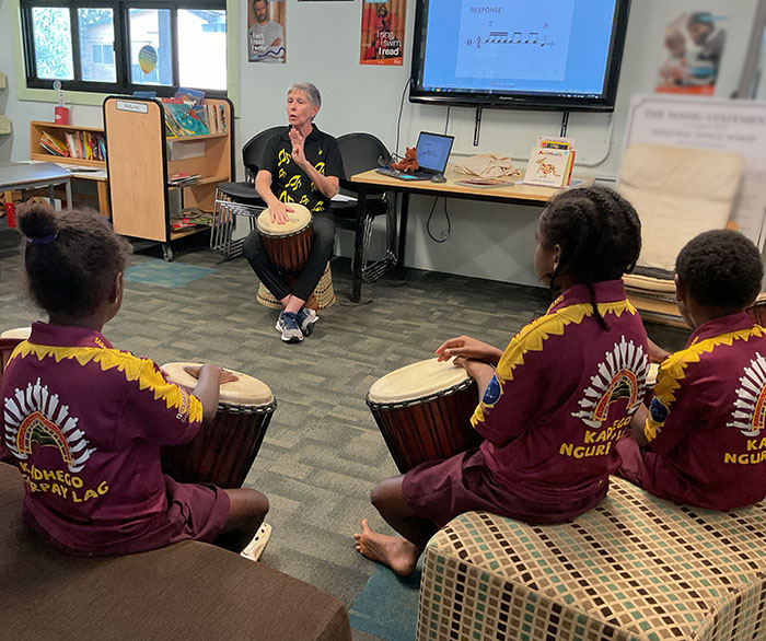 Mrs Mac teaching djembe to students