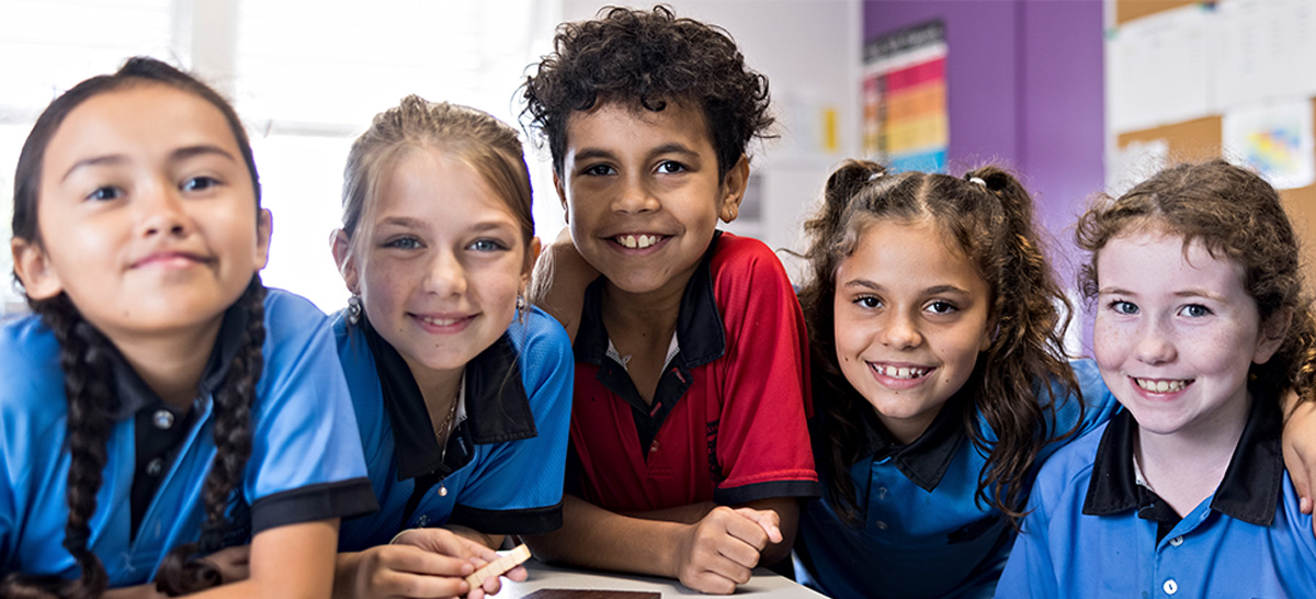 Students sitting at a desk together